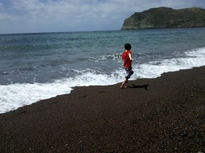 Boy at Red Beach, Santorini, Greece